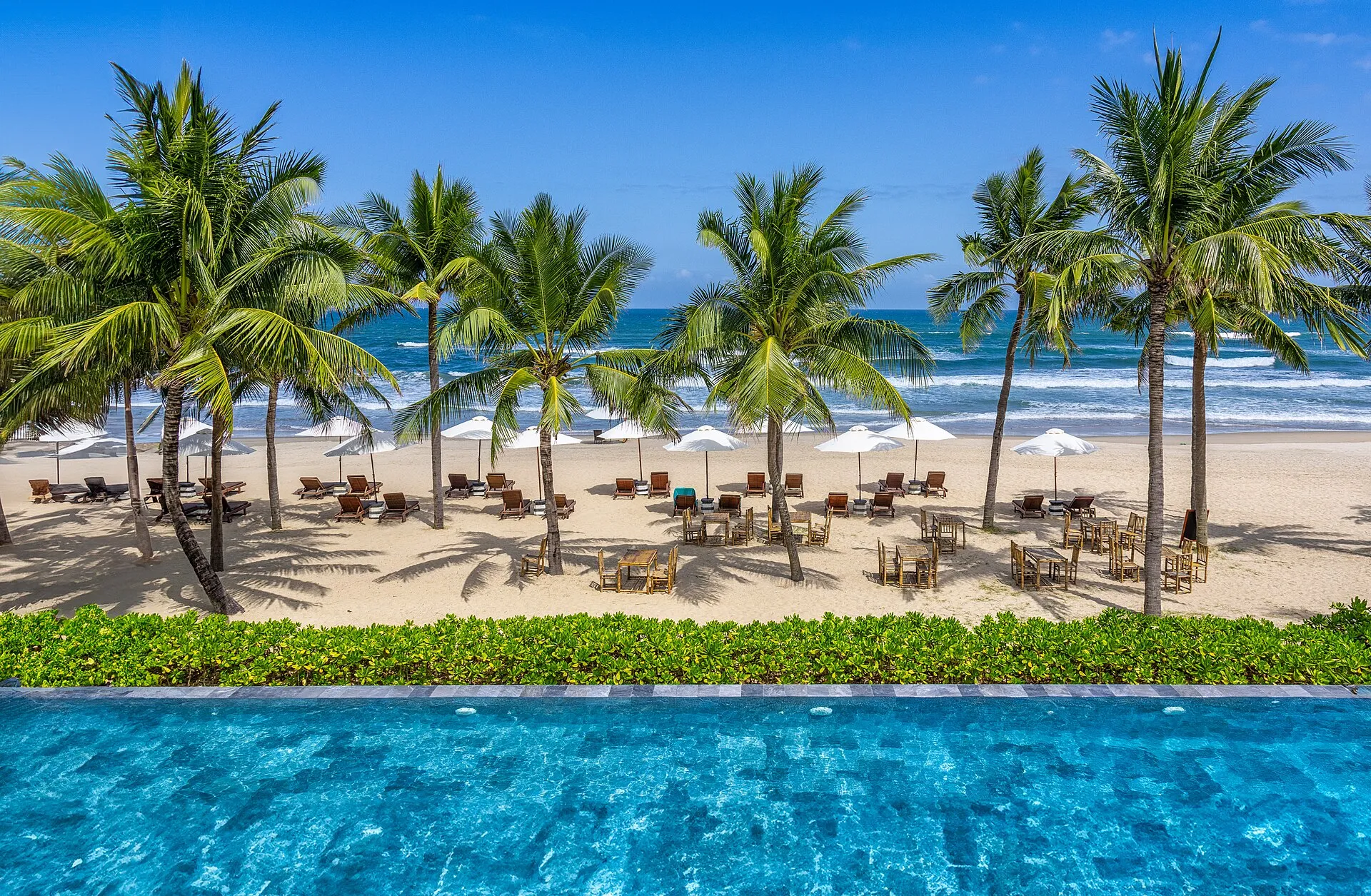 Palm trees and beach umbrellas on My Khe Beach